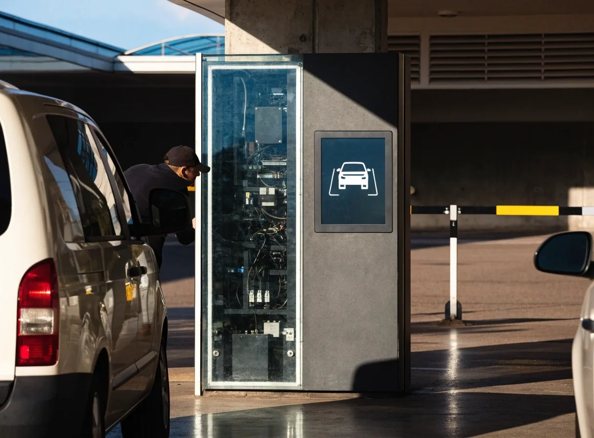 Car park entry gantry at an airport terminal precinct with the boom arm mid-lift