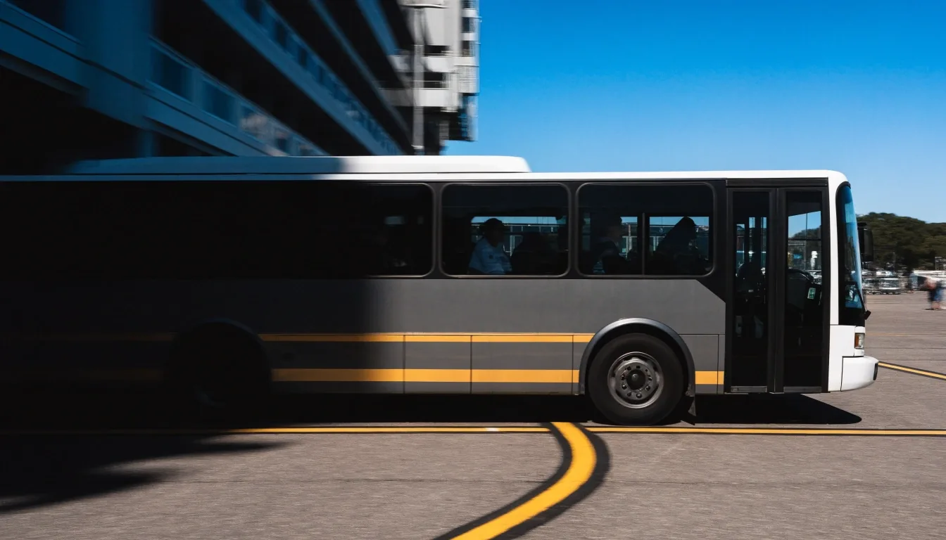 Shuttle bus on the airport precinct apron with motion blur at the wheels